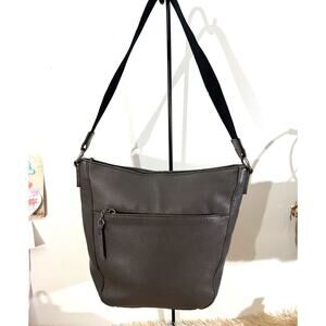 The Sak EUC Lucia Crossbody bag in gray pebbled leather. Woven Strap Zip Top